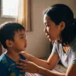 Filipino mother calmly guiding her child at home without spanking, teaching with love and patience.