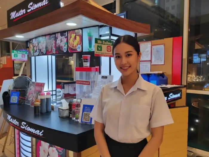 Master Siomai food cart franchise booth with bright orange branding