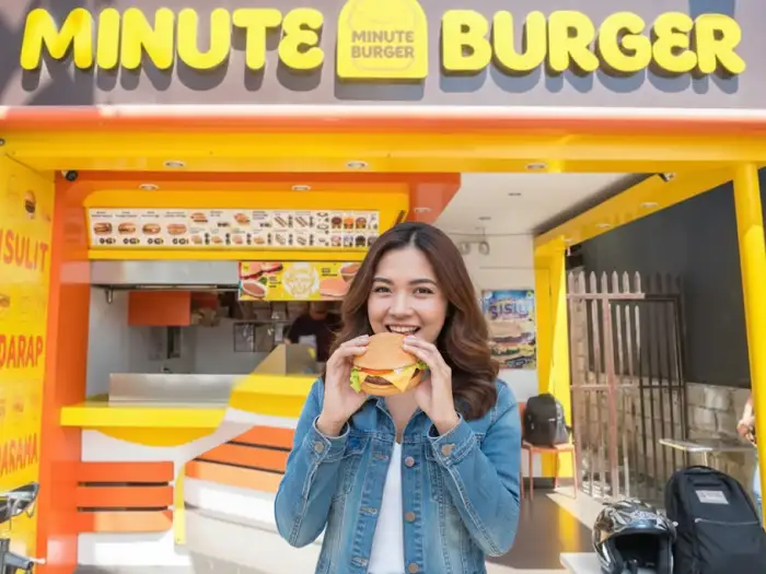 Minute Burger food kiosk franchise in the Philippines with griddles and signage