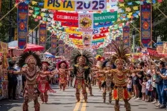 Colorful Philippine festival street parade with dancers in traditional costumes.