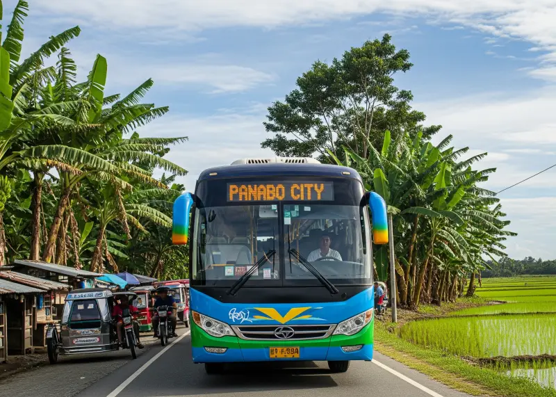 A rural bus driving through banana plantations and rice fields toward Panabo City.
