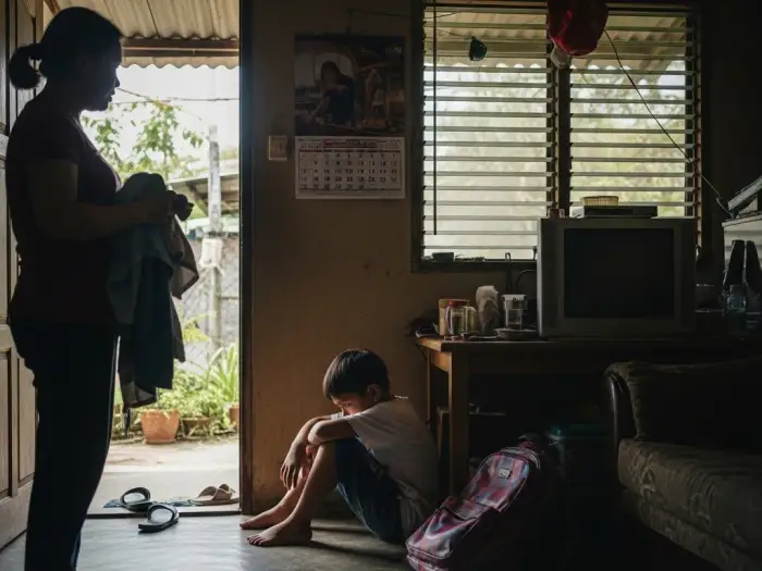 Filipino child showing signs of being bullied at school in the Philippines.