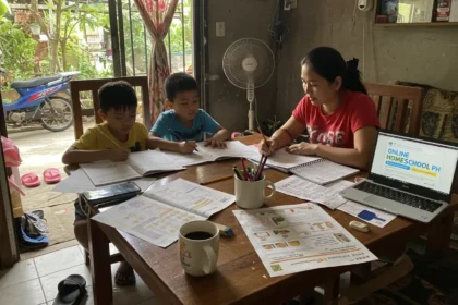 Filipino mother teaching her children at home as part of homeschooling Philippines.