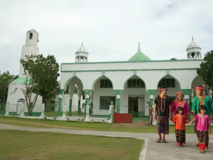 The Sheik Karim al-Makdum Mosque in Simunul, Tawi-Tawi, with the beautiful turquoise sea in the background.