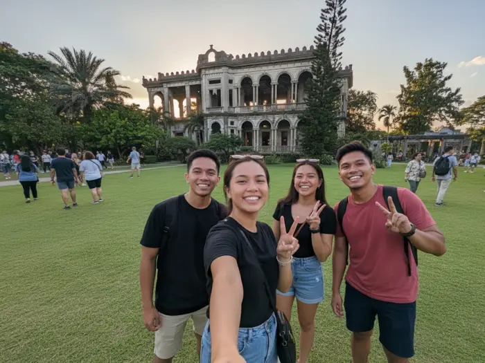 Four friends take a laughing selfie in front of The Ruins in Negros Occidental.
