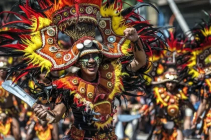 Tribal dancers performing during the Dinagyang Festival street parade in Iloilo City.