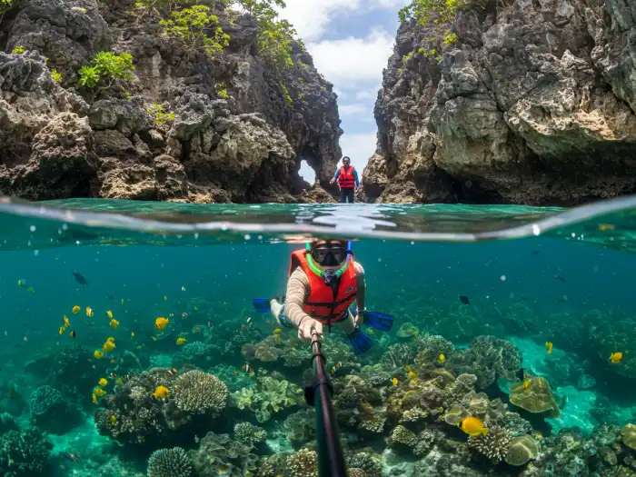 Snorkelers explore coral reefs and limestone-enclosed lagoons in El Nido’s Secret Beach.