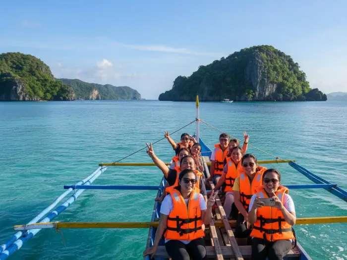 Filipino tourists riding a motorized banca on the way from Siargao to Sohoton Cove in Bucas Grande.