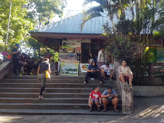 Filipino hikers attending orientation and registering at Mount Pulag Ranger Station.