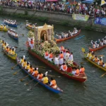 Voyadores escort the image of Our Lady of Peñafrancia on the Naga River during the fluvial procession.