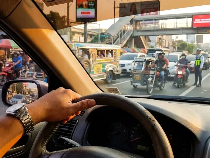 filipino driver using signal lights road courtesy philippines Filipino driver using road courtesy signal lights before changing lanes on a busy Philippine road.