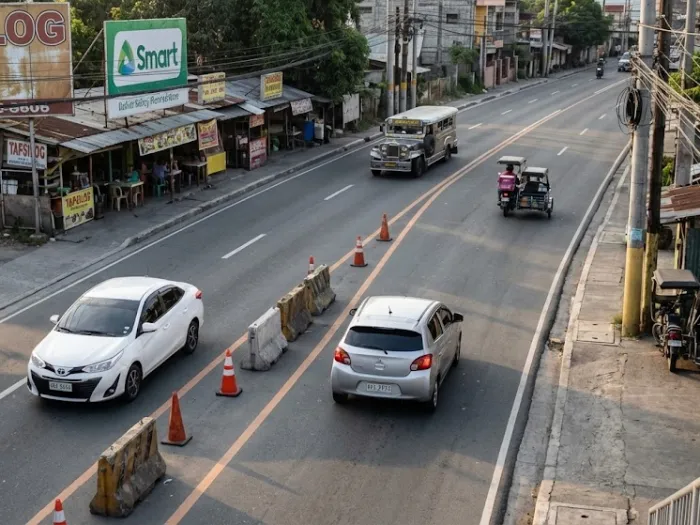 zipper merge courtesy filipino driving philippines Filipino drivers performing a courteous zipper merge on a narrowing road.